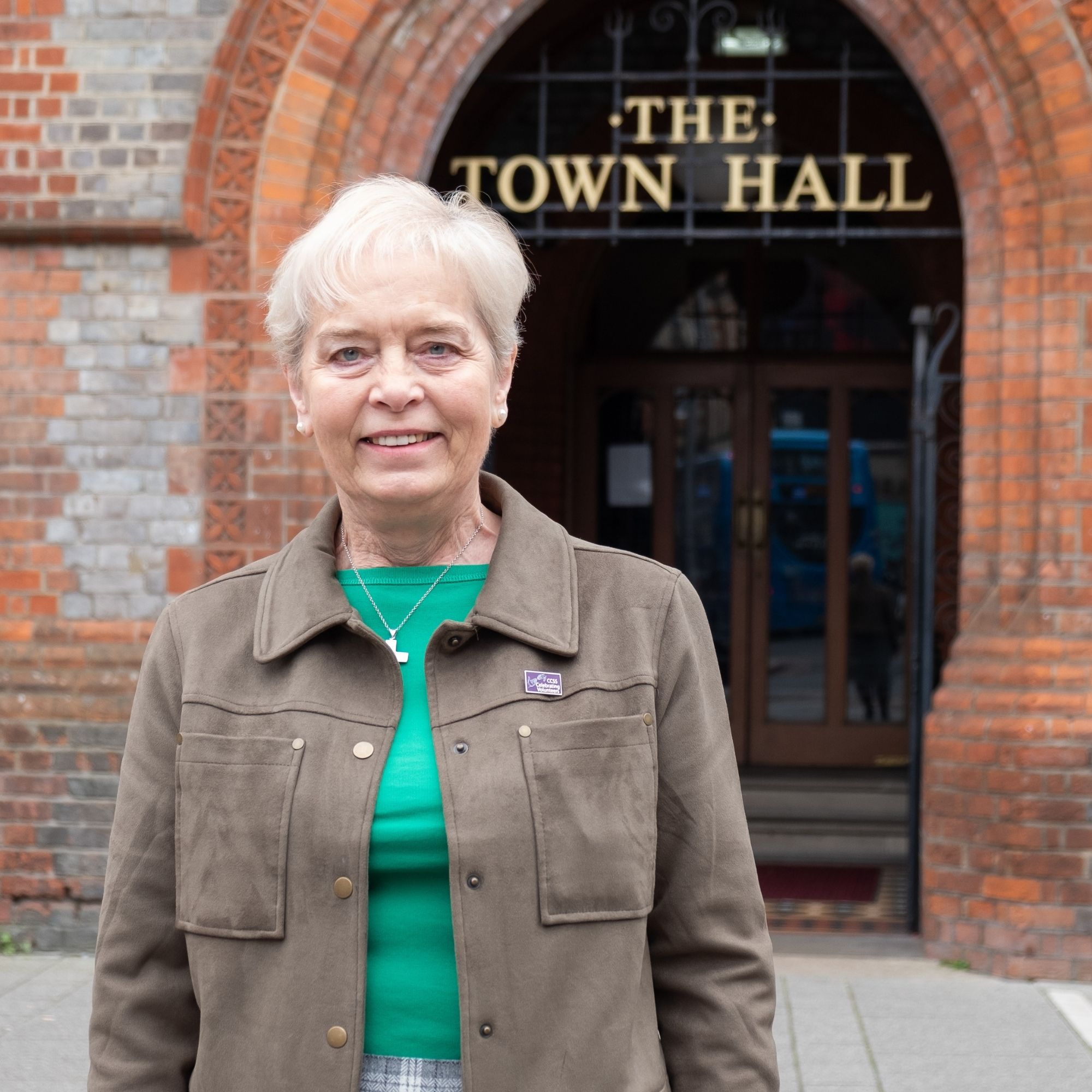 Joy Abel stands in front of Reading Town Hall