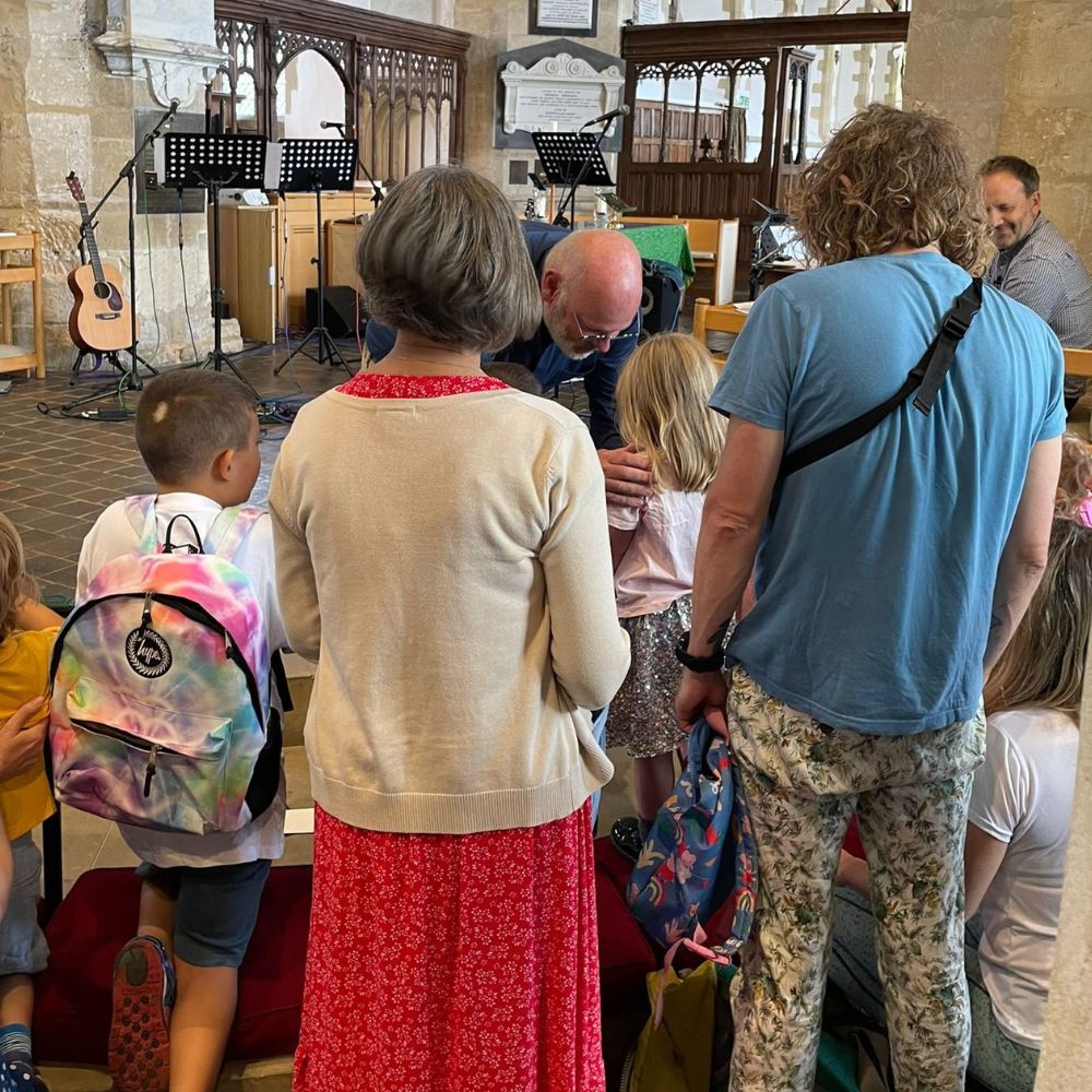 The vicar of St Mary's blesses children and adults ahead of their new ventures.