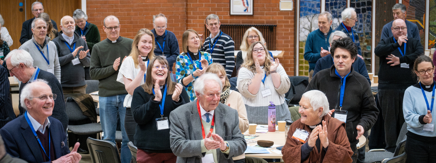 Synod stand in applause 
