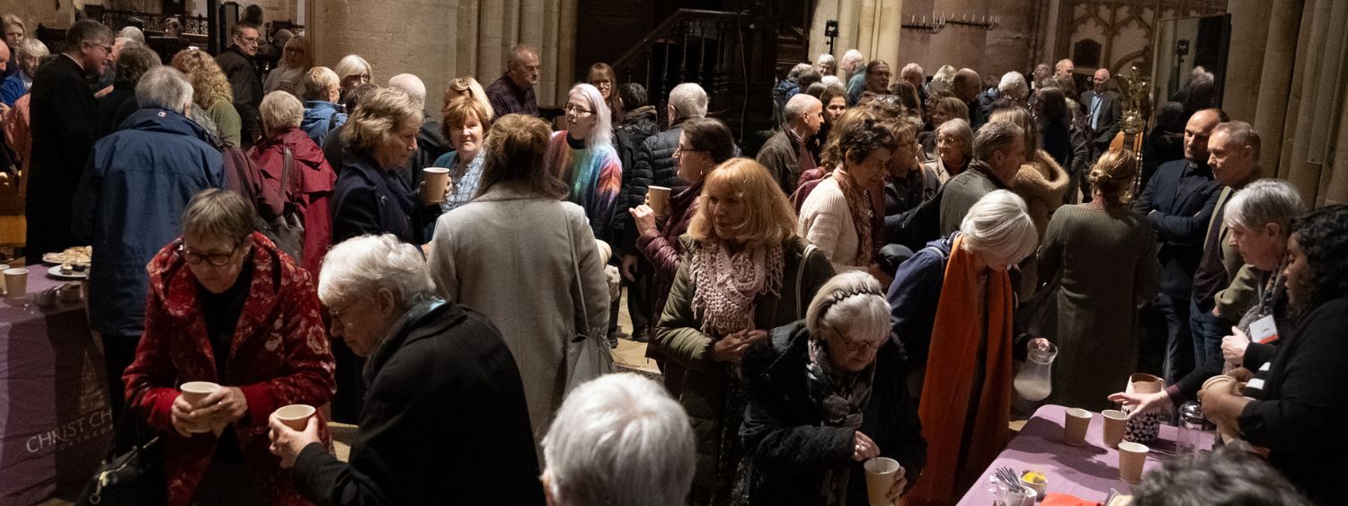 People chat together over refreshments following a Safeguarding Sunday service at Christ Church Cathedral, Oxford.