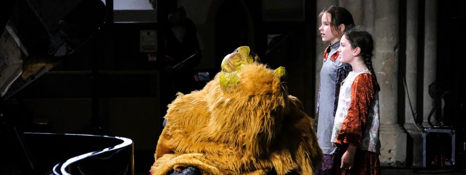 Two children perform in a play