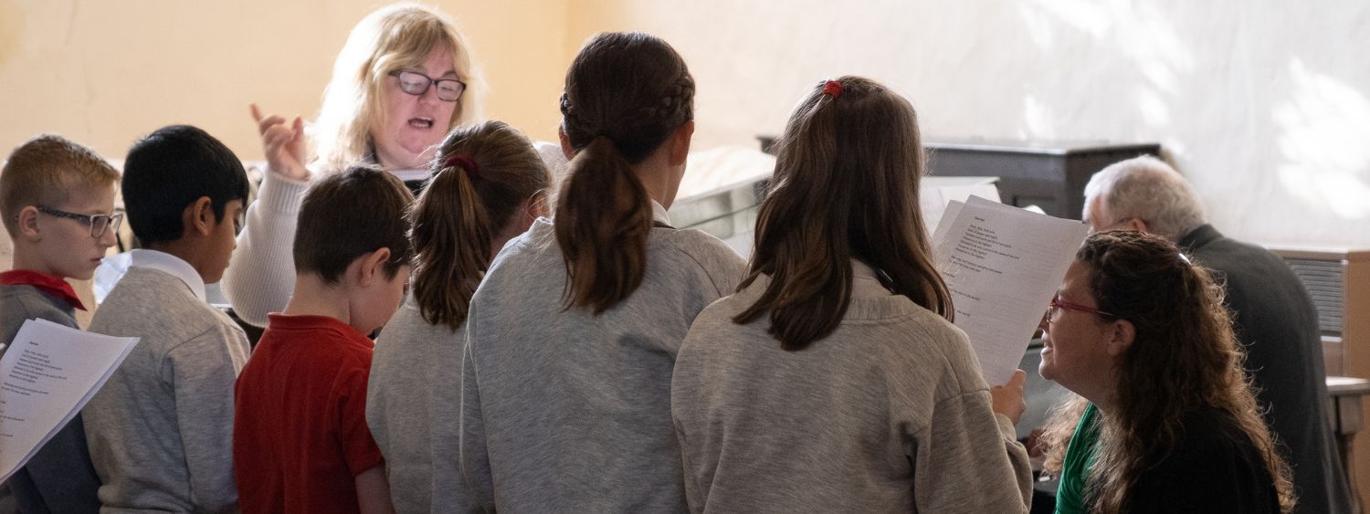 A group of children at a school church service.