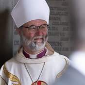 Bishop Alan pictured in front of a church