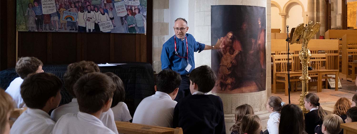 Revd Charlie Kerr, talks with school children