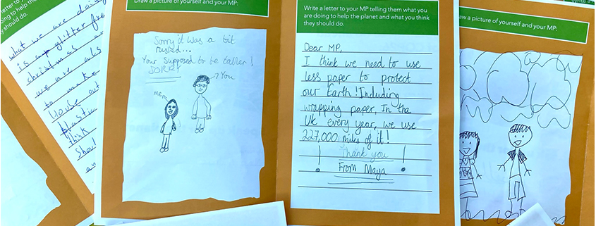 Photo of letters handwritten by school children to their MPs regarding climate change