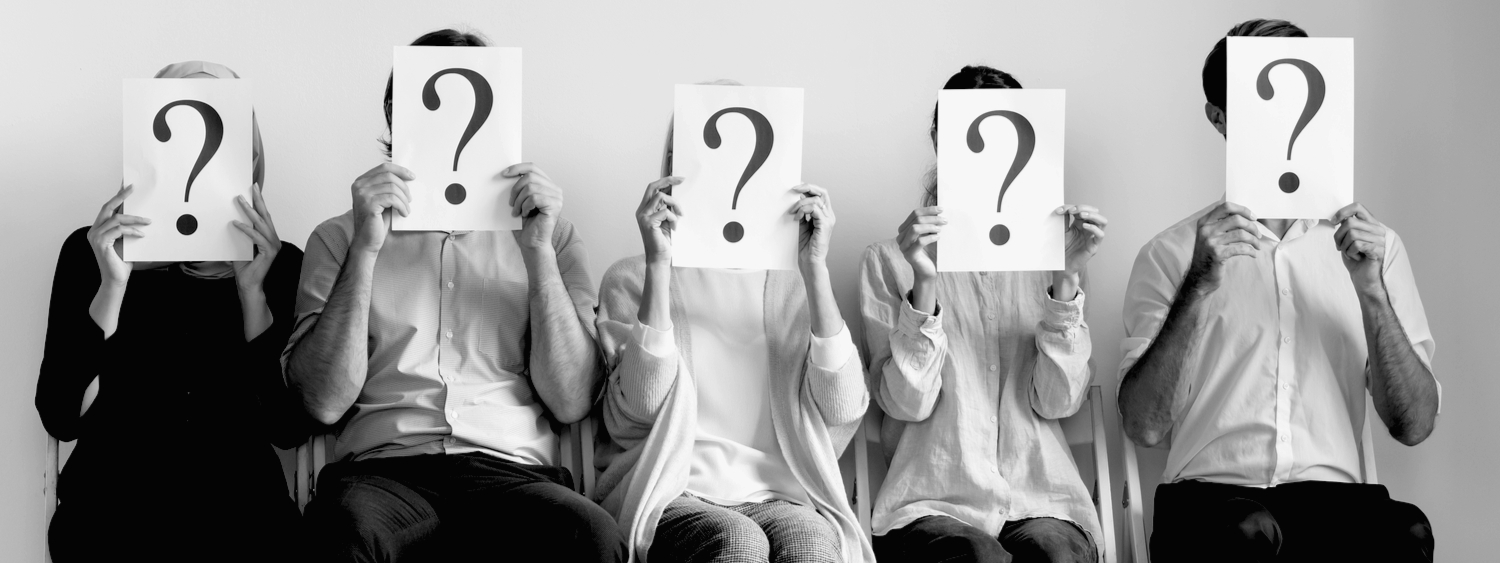 Illustrative image posed by models. Five people in a row with question marks in front of their faces
