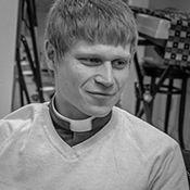 Black and white headshot of the Revd Rob Glenny