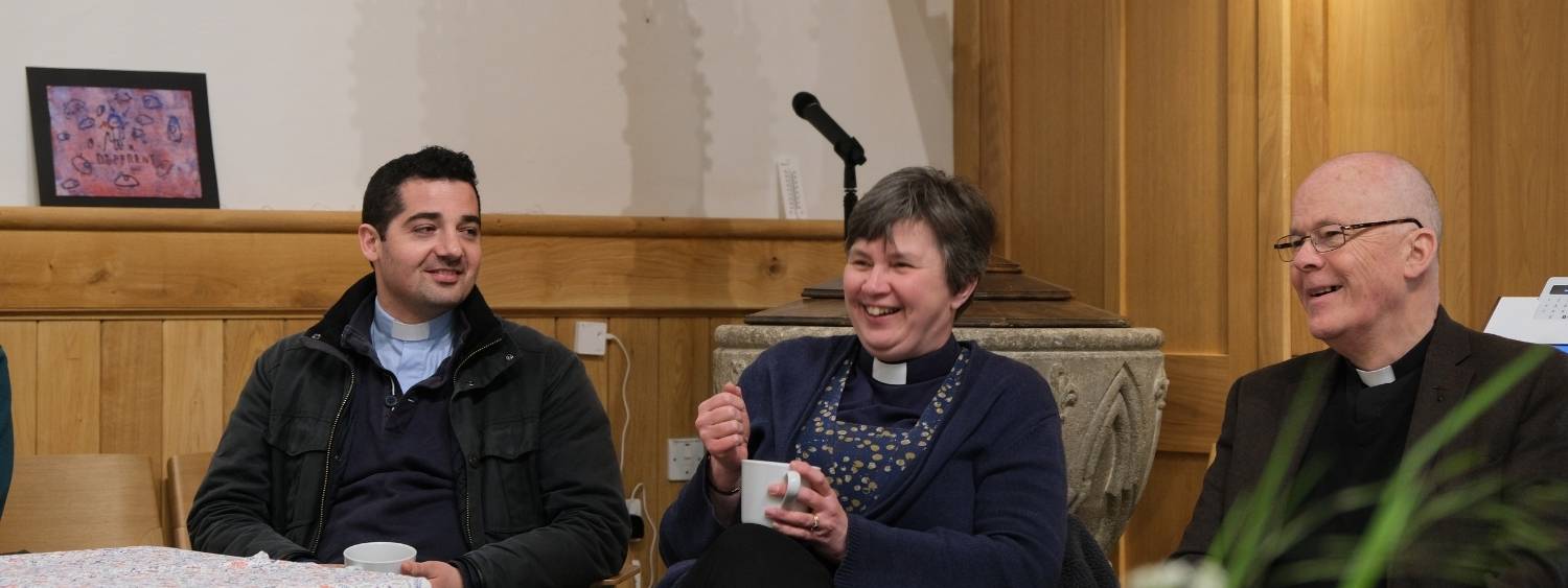 Three clergy in Cowley Deanery smiling and laughing