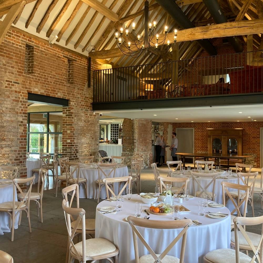 Rackleys Barn event venue round tables and chairs set for wedding.