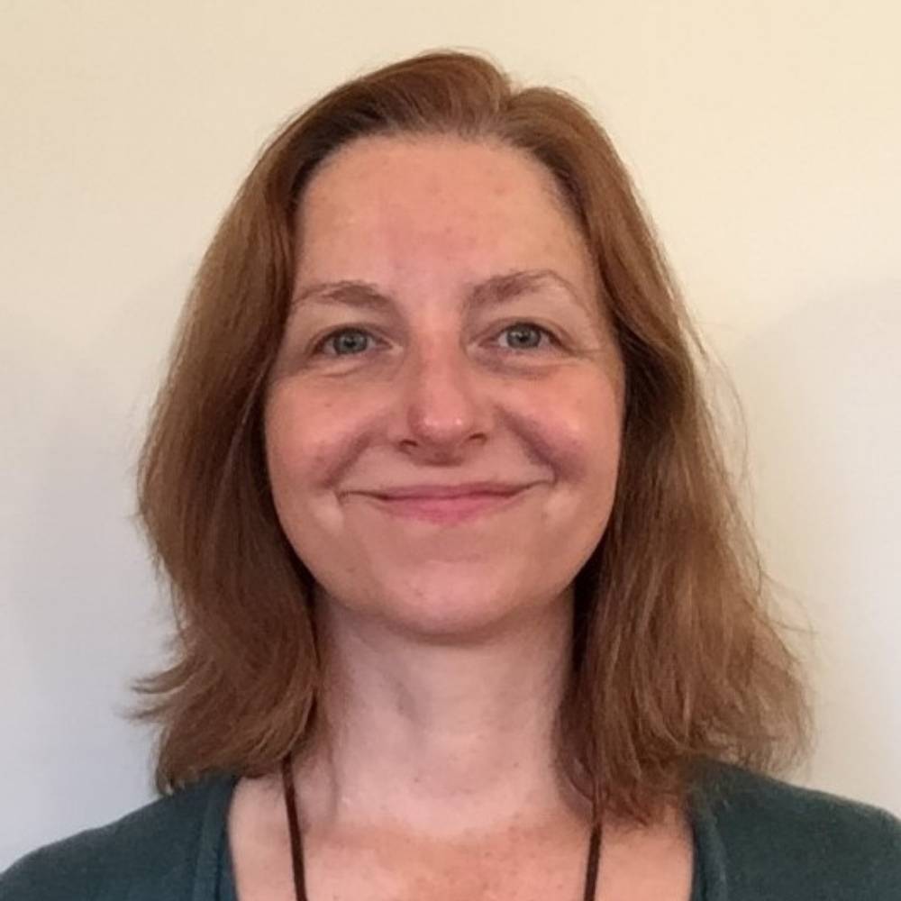 Head shot of Vicky Burton smiling with closed mouth