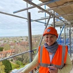 Val in high-vis jacket and helmet at Canterbury Cathedral