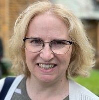 Headshot of Anne smiling