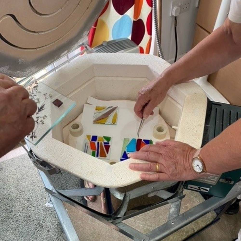 Mosaic tiles being placed in a kiln