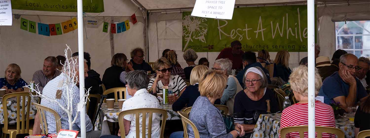 People gather at the Rest A While stall at the Bucks County Show.