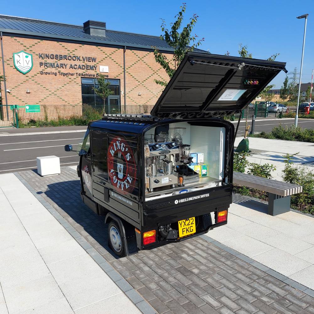 Small coffee van sitting outside Kinsgbrook View Primary Academy school building on the new Kingsbrook Estate