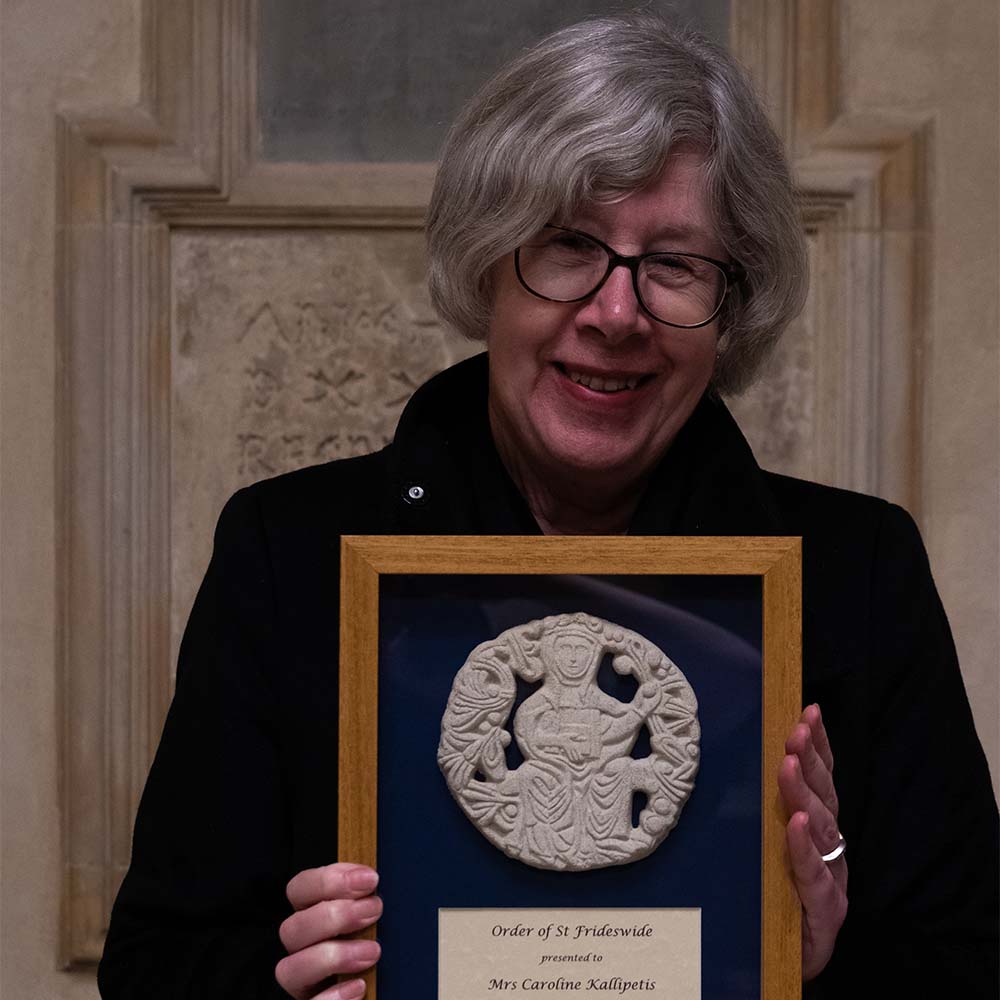 Caroline Kallipetis poses with her Order of St Frideswide plaque