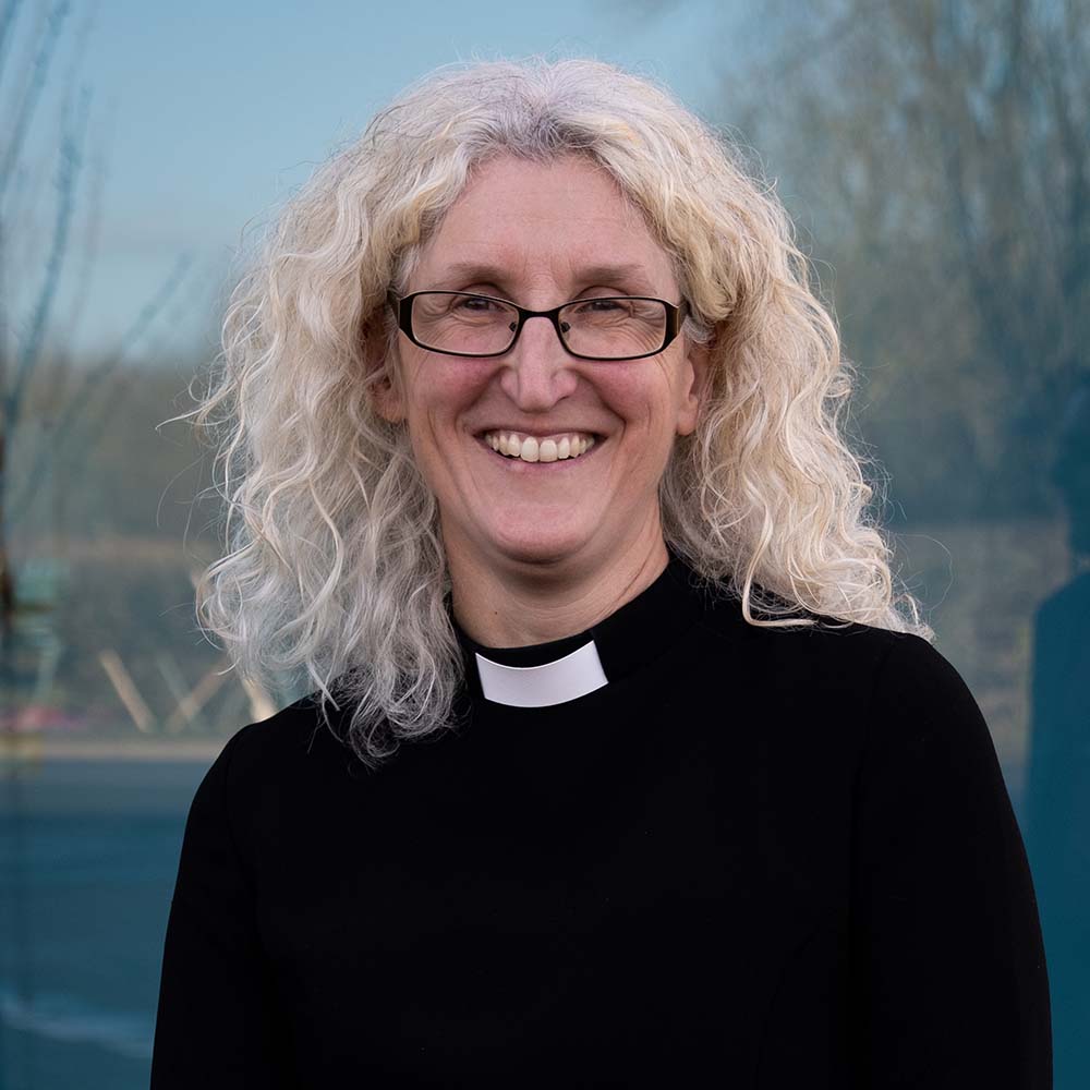 The Revd Preb Jane Haslam is smiling and stands outside Church House Oxford 