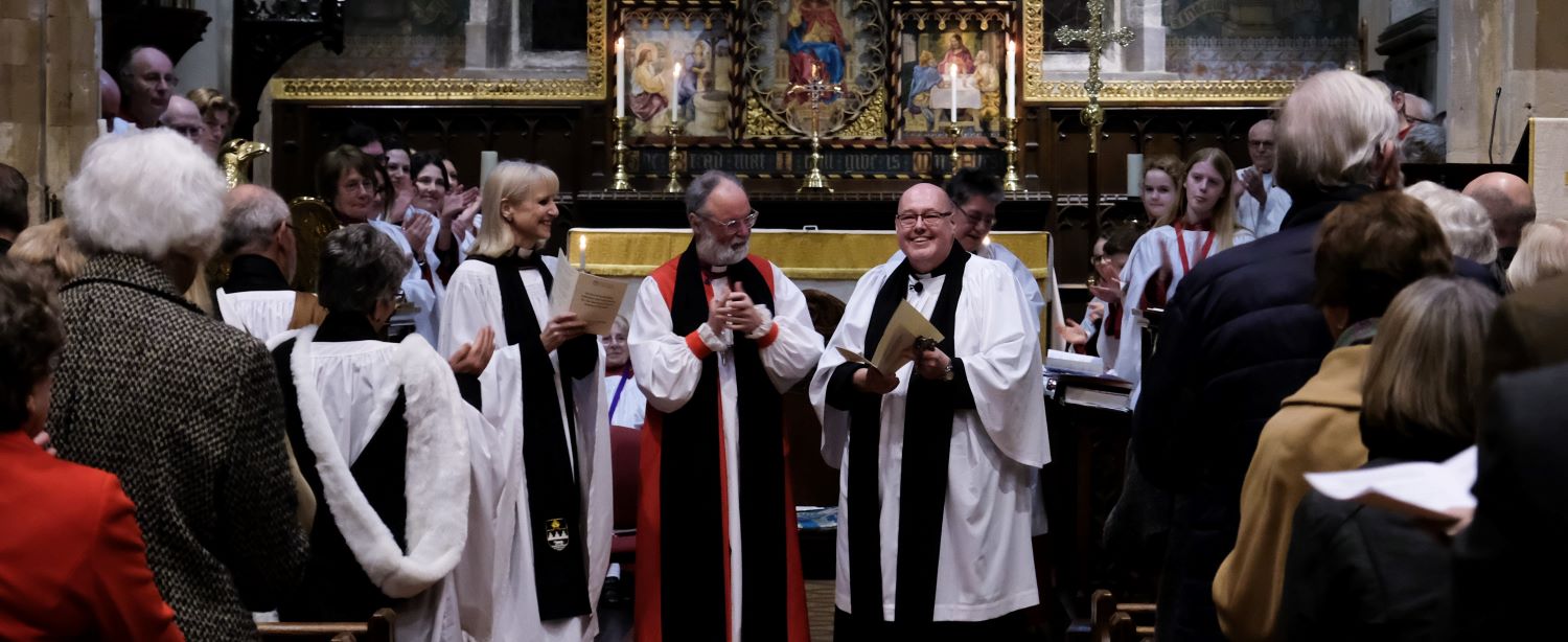 Three clergy at the front of a service
