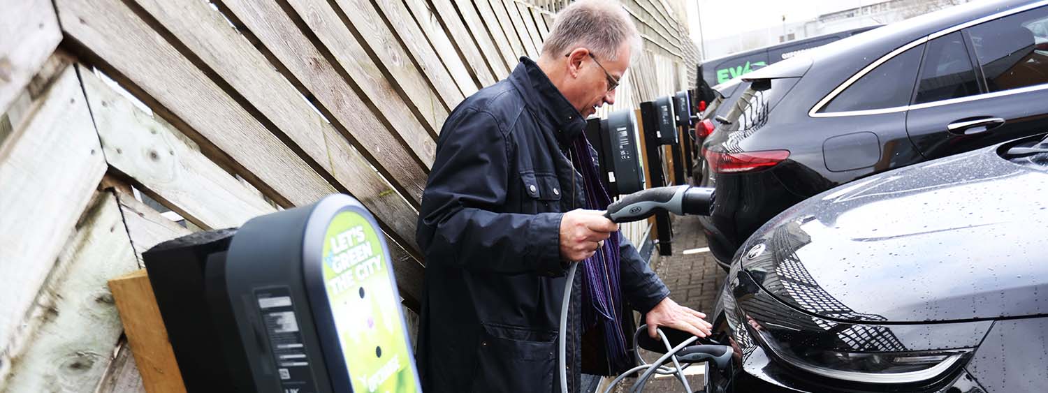 Bishop Steven using one of the new vehicle chargers at Church House Oxford