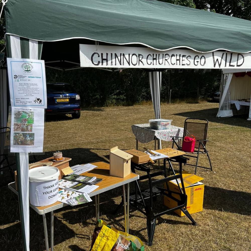 Chinnor Churches Go Wild marquee with a stall in a field