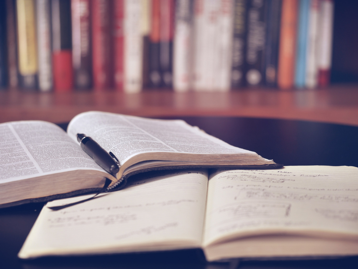 Books and pen on a table